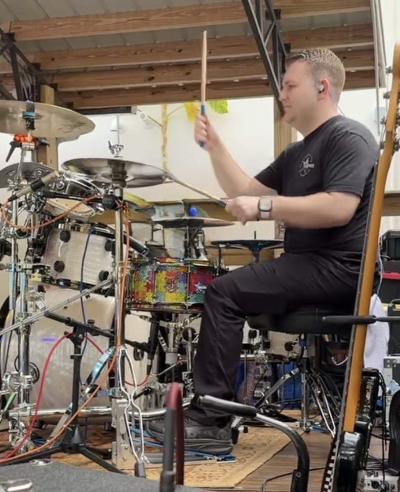 Stephen Lepore playing his dad's drum kit with the band