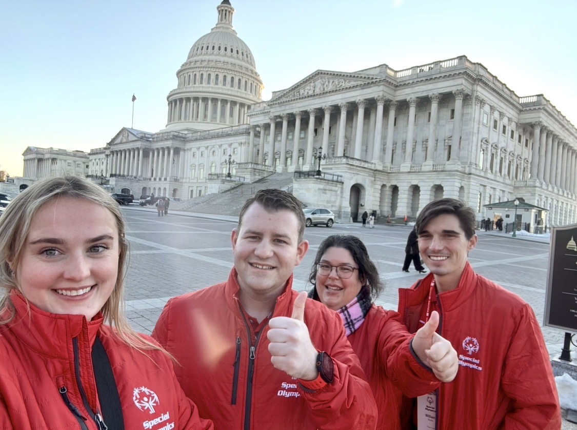 Stephen Lepore with fellow Special Olympics advocates in red jackets in front of the U.S. Capitol