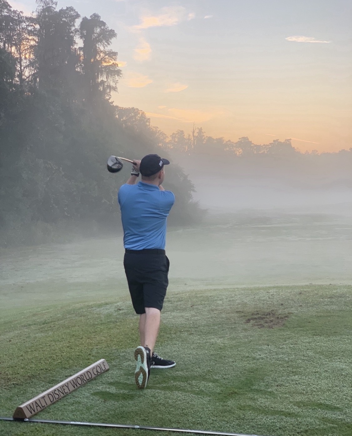 Stephen taking a golf swing at Walt Disney World Golf during morning practice