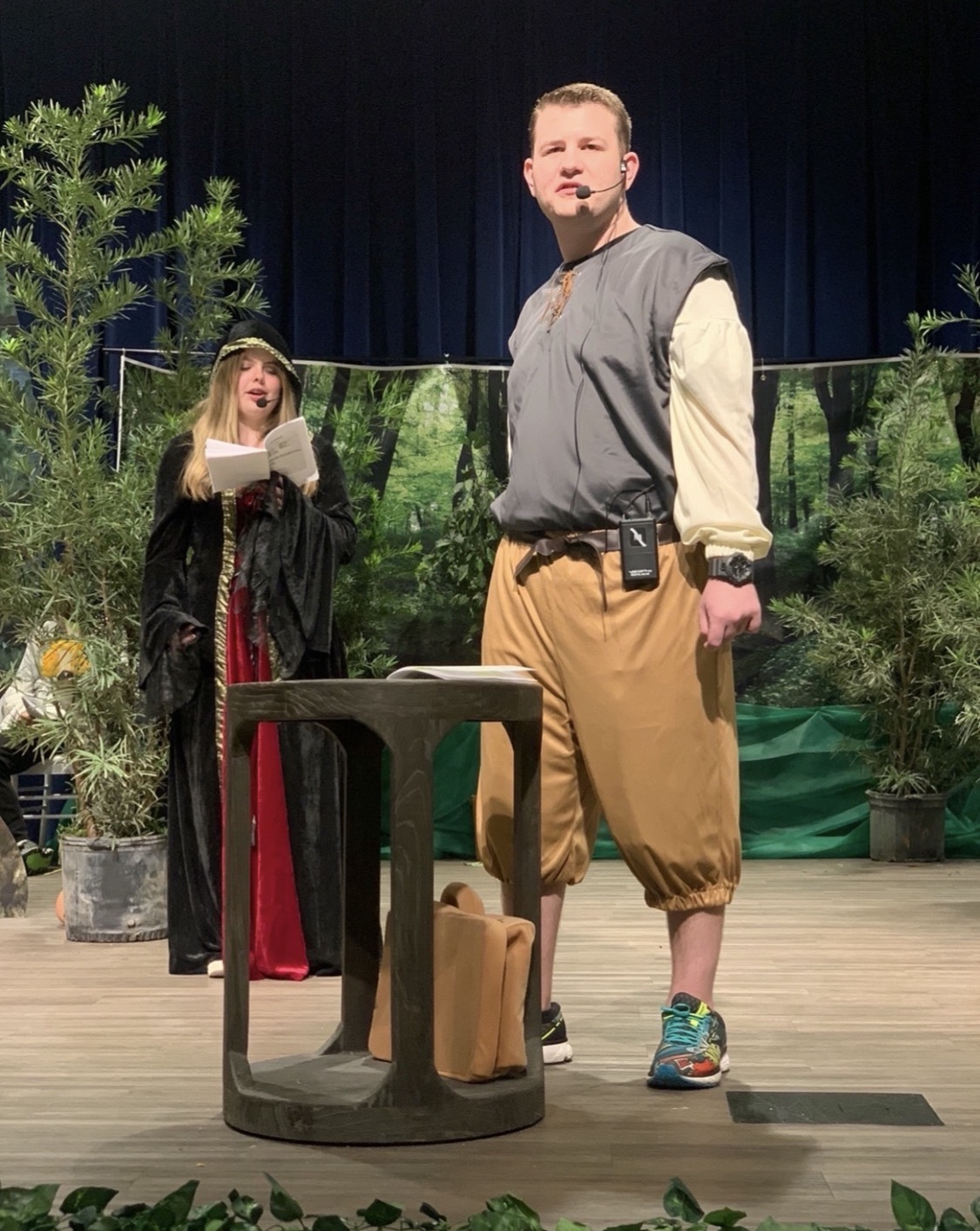 Stephen performing on stage in a stage production of Into the Woods