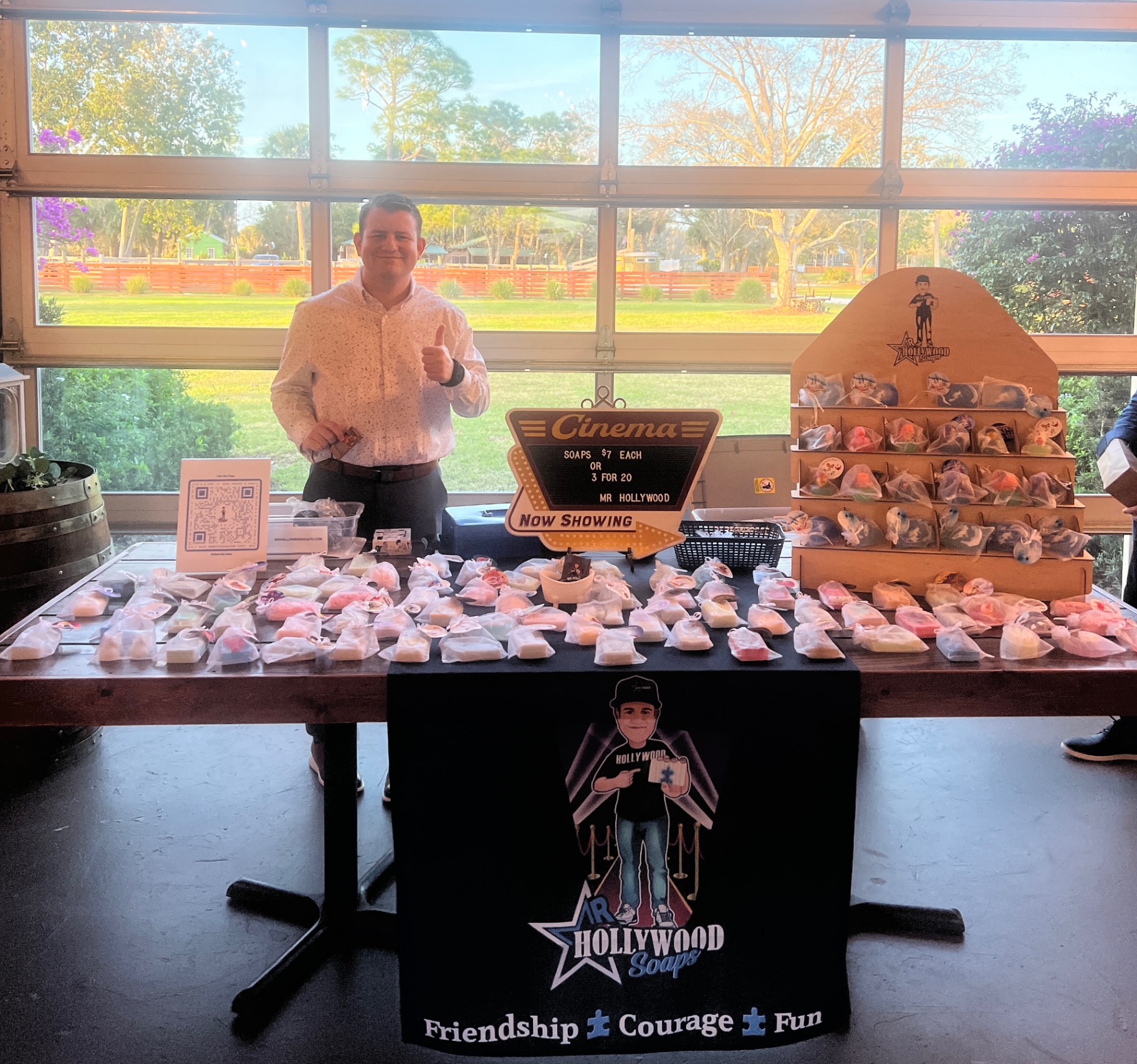 Stephen Lepore behind his Mr. Hollywood Soaps vendor table with handmade soaps and display